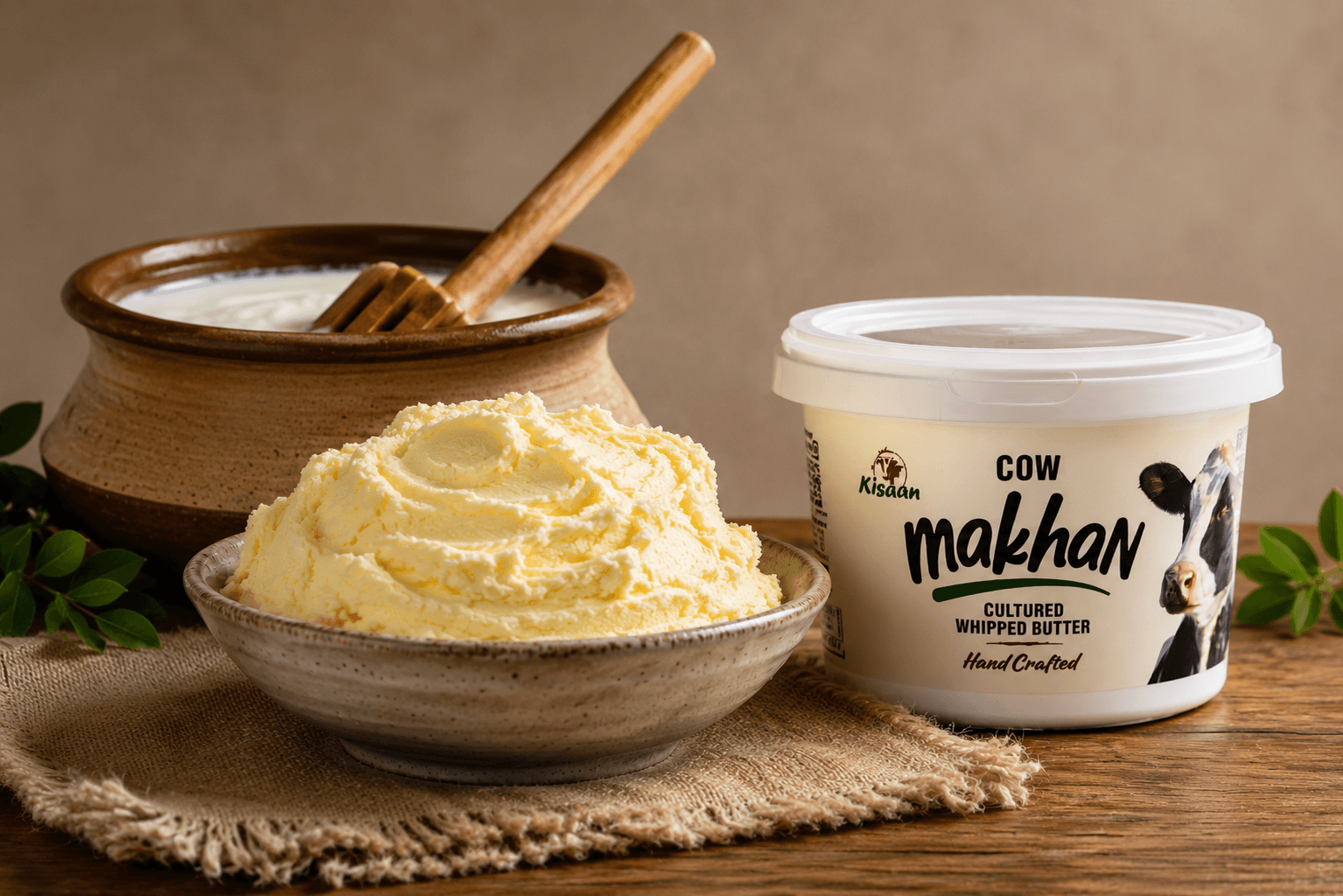 Kisaan Cow Makhan with freshly whipped pale-yellow Cow Makhan and traditional Indian churning vessel